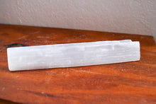 Load image into Gallery viewer, Singular Selenite wand placed on bench to show individual product, white in colour