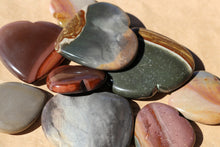 Load image into Gallery viewer, Polychrome Jasper Hearts in varying palm sizes, in shades of storm grey, green and warm oranges
