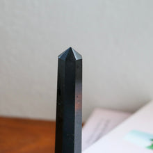 Load image into Gallery viewer, Close up - Tall Slender Black Tourmaline Tower with books in the background
